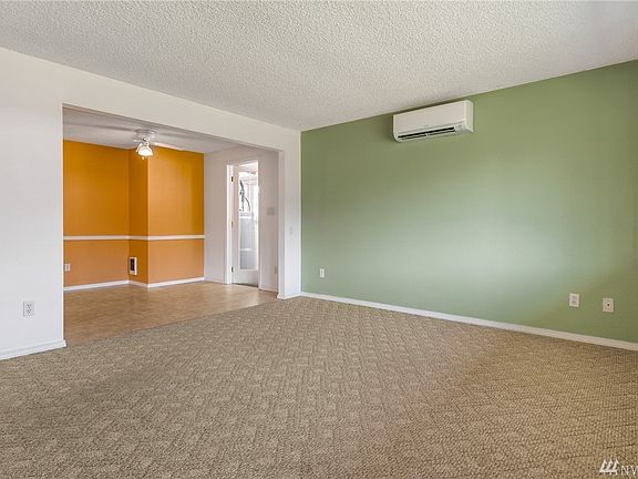 The living room flows freely into the dining room. 