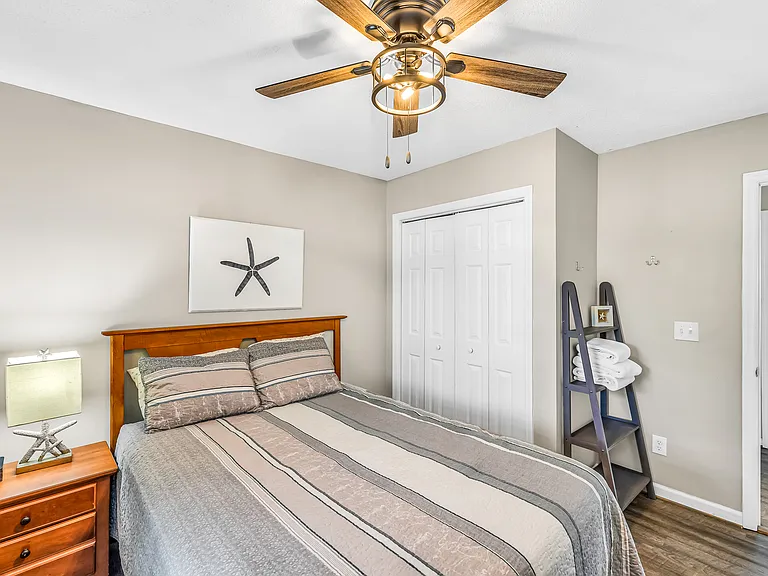 Queen bed in guest bedroom
