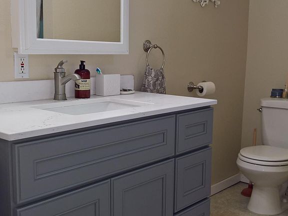 Bathroom with new vanity, custom quartz counter & lighting
