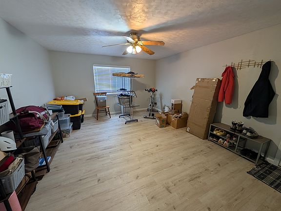 View of the bonus room adjoining the garage. Washer and dryer go in this room, though they are not visible in this picture.