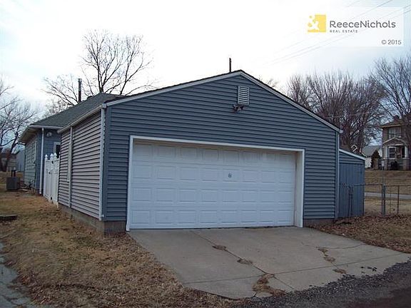 Oversized garage, pull-down ladder to attic storage, boat storage to the right
