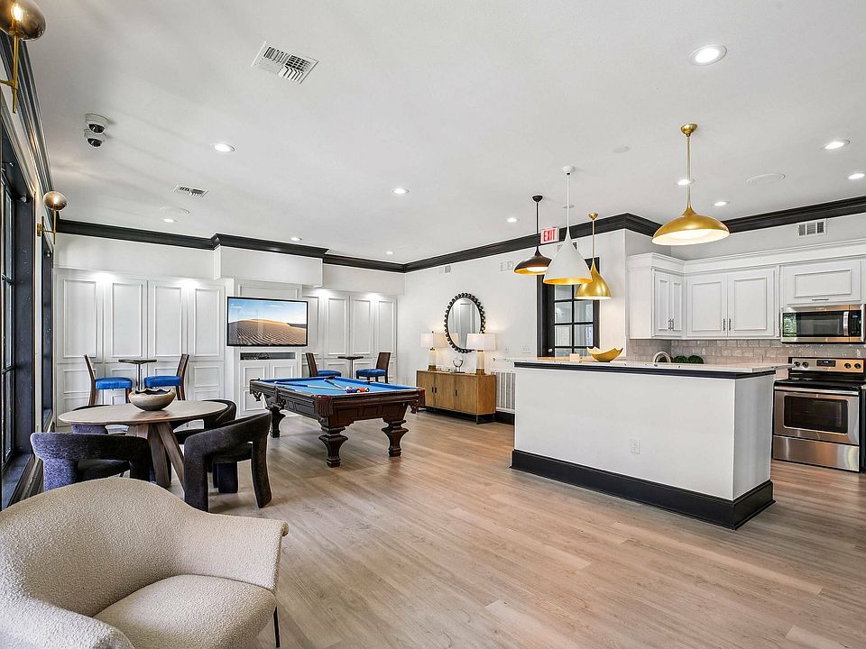 Enjoy the resident gaming lounge at Providence Uptown with media entertainment, cozy seating, and social spaces.