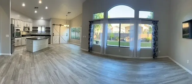 Beautiful entry into spacious great room and kitchen looking out into peaceful backyard. - 665 W Adagio Ln