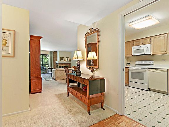 Foyer with parquet floor opens to LR DR