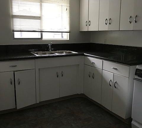 Kitchen w new granite counters and vinyl