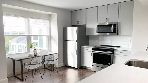 Our renovated kitchens offer brand new cabinetry, quartz countertops, and stainless steel appliances - Windsor Village at Waltham