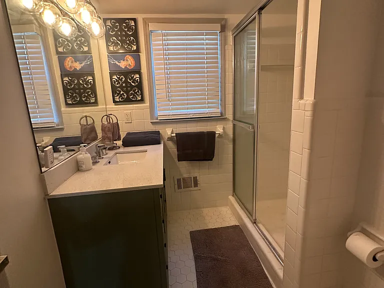 Downstairs shared bathroom _ clean, modern, and easily accessible.