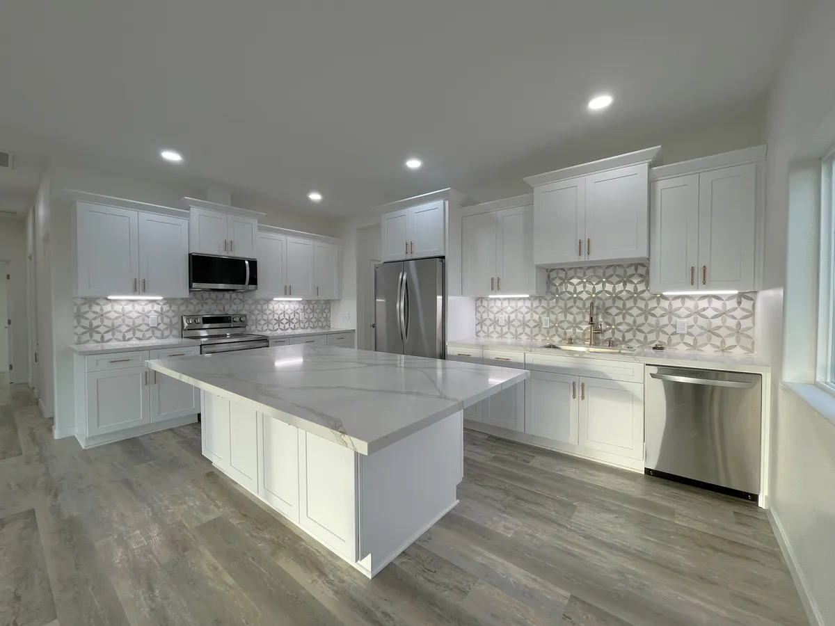 Gourmet kitchen with oversized island and new stainless steel appliances. - 2405 Aqua Hill Rd