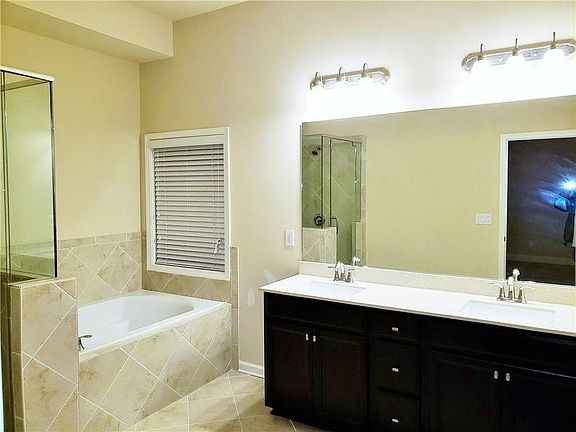 Owner suite double vanity with standing shower