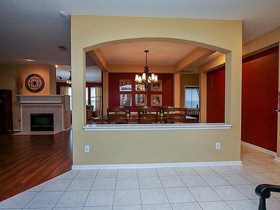 Tiled entry way, leads to rich laminate floors in Dining, Living area and den.