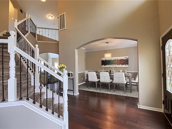 Wood flooring, iron stair rails, open and spacious!
