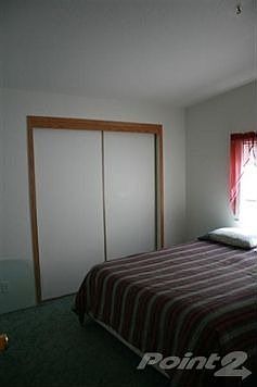 one of three bedrooms