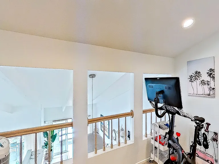 Loft area equipped with Peloton (SPD), yoga mat, blocks and hand weights.