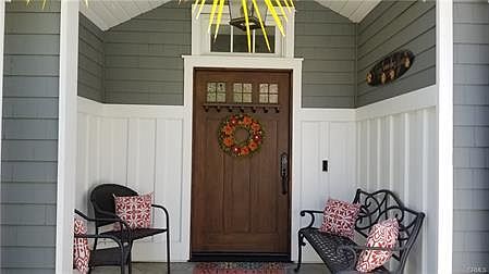 Such an inviting entry. Custom woodwork can be found in all rooms.