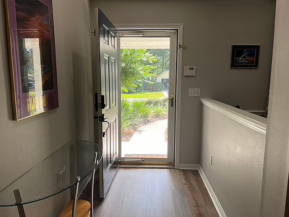 Foyer with glass storm door
