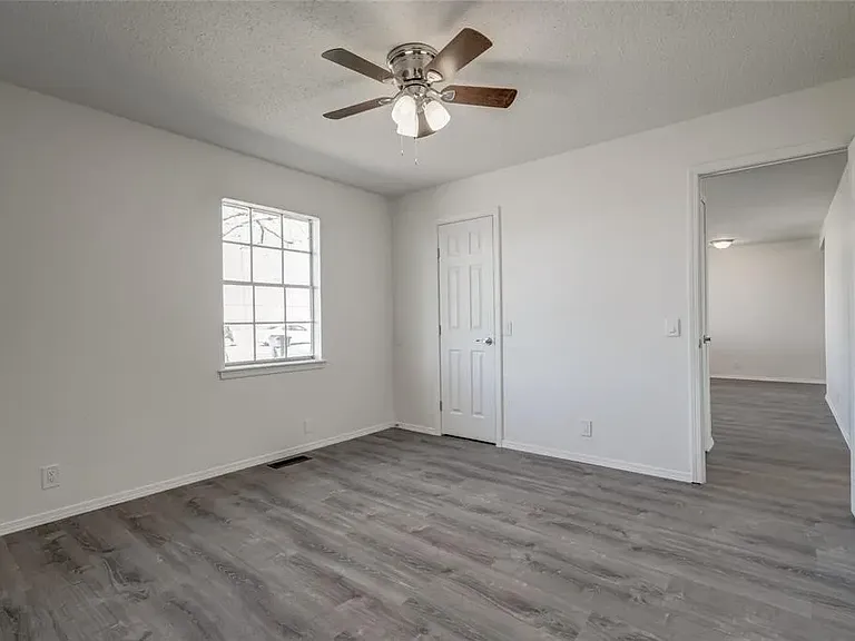 Master Bedroom with walk-in closet looking down hallway