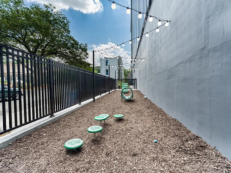 A dedicated pet run offers a convenient space for play and fresh air, thoughtfully designed for four-legged companions in the heart of Atlanta.