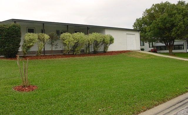 Side of house w/golf cart garage