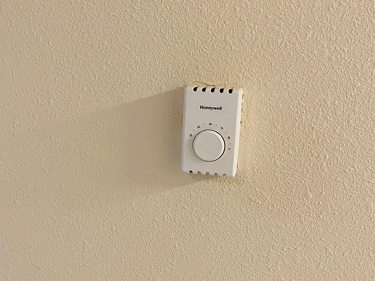 Wall thermometer in each room