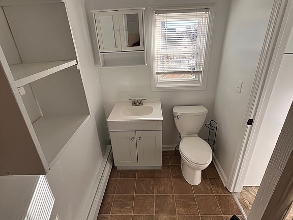 Bathroom w/ brand new vanity and shelves