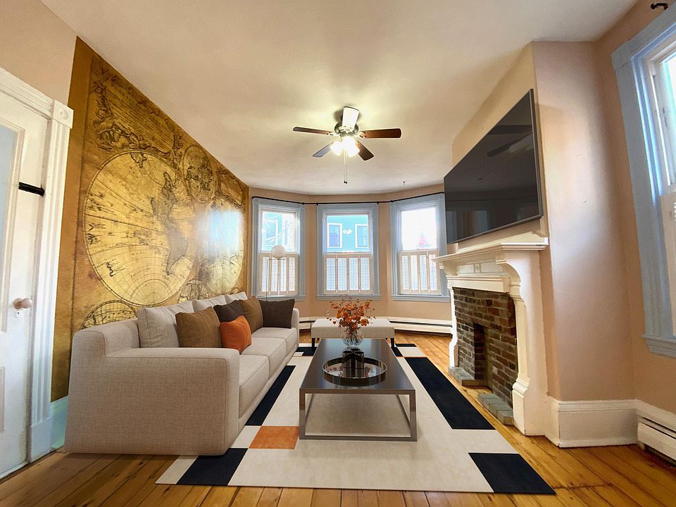Virtually staged living room facing Monument Ave.
