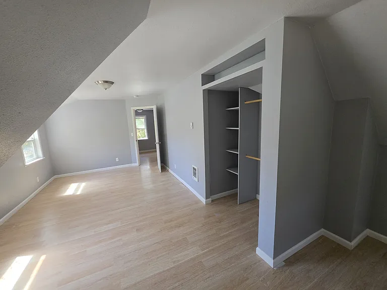 Upstairs primary bedroom (view towards entry)
