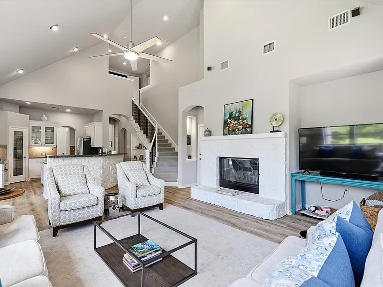 Family room with soaring ceilings and gas fireplace.