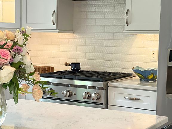 Fully renovated & equipped kitchen featuring Wolf stove