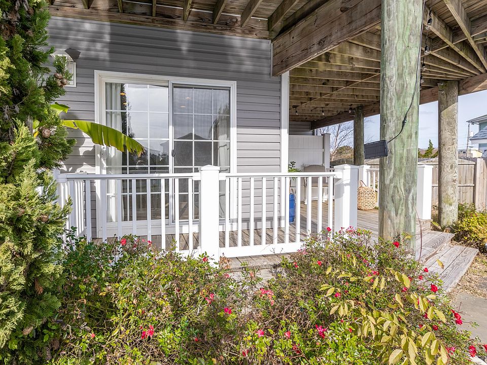 Lots of natural light with 2 sliding glass doors. Wrap around deck . Option to close curtains for privacy as well.