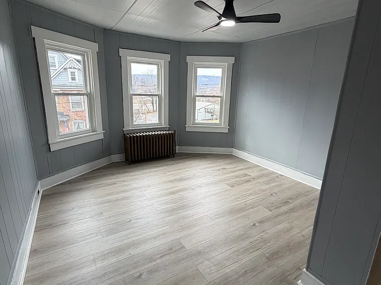 Front bedroom with remote control ceiling fan