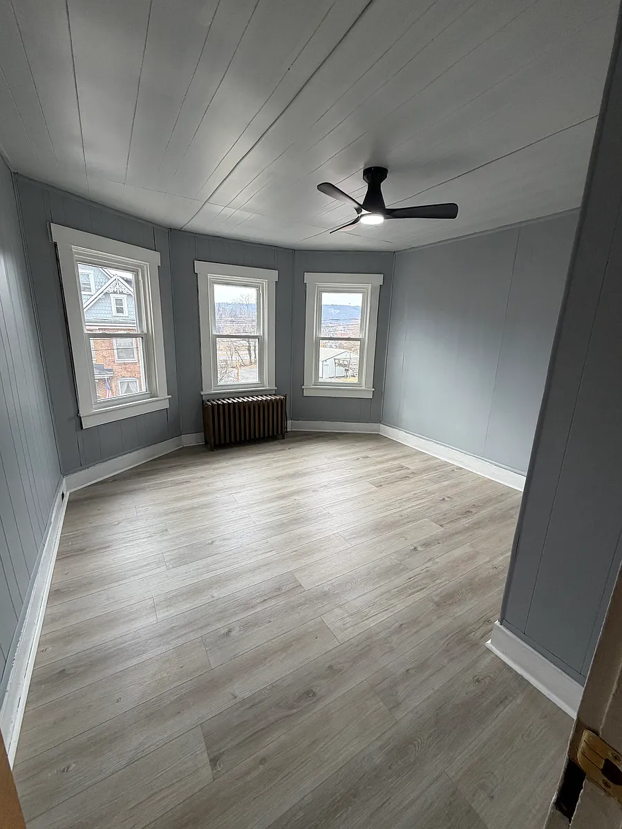 Front bedroom with remote control ceiling fan - 102 Oak St