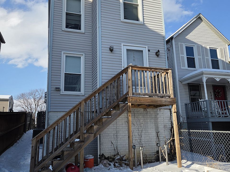 Front of home with entrance under stairs