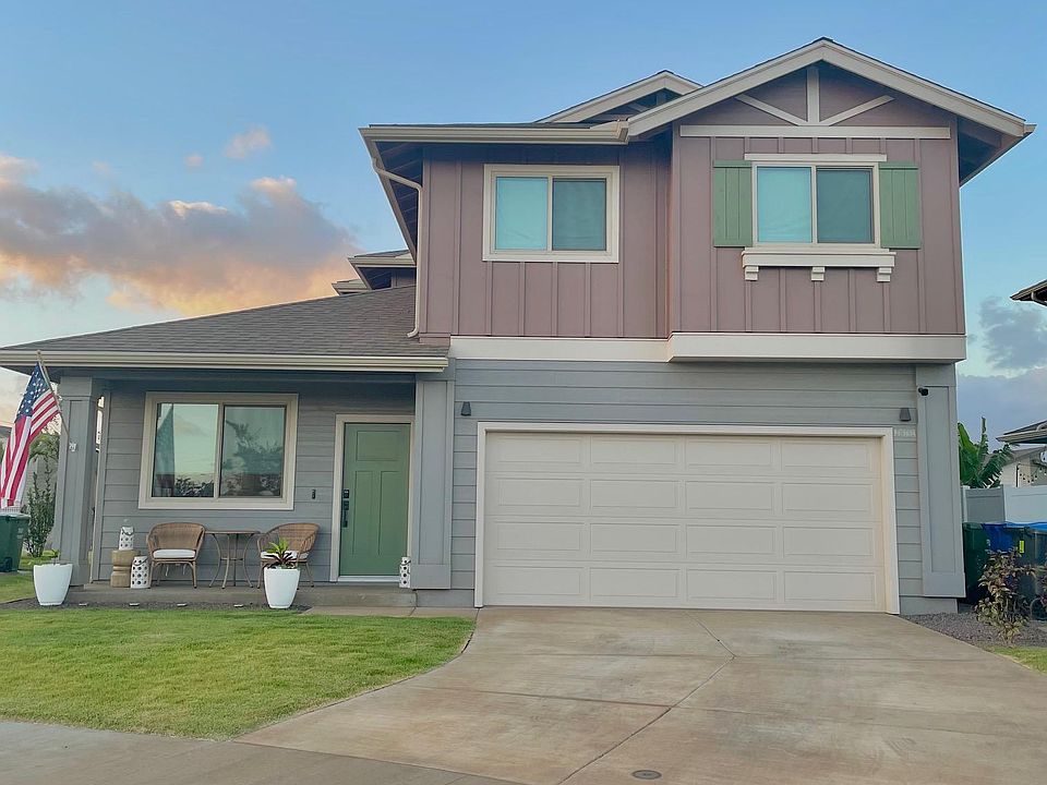 Front with Lanai area, 2 car garage and 2 car driveway parking.