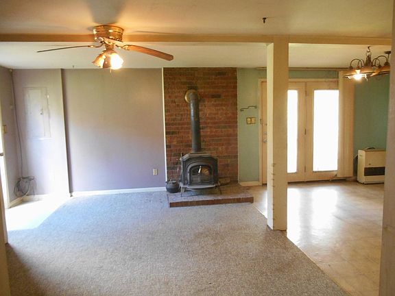 Open living area with wood stove, mini-split heat and AC