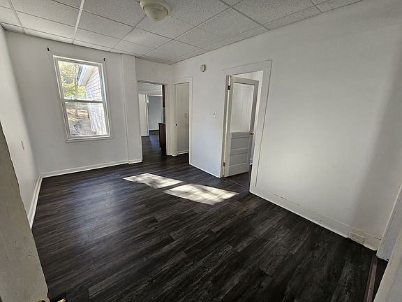 dining room
right door main bedroom
middle door bathroom
left doorway to kitchen