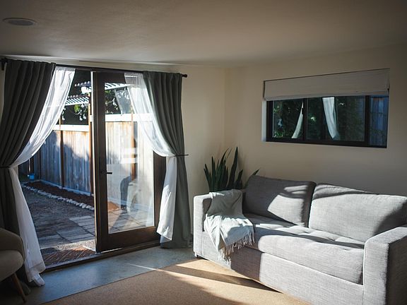 Comfortable Article sofa pulls out to a queen size bed with memory foam mattress topper.