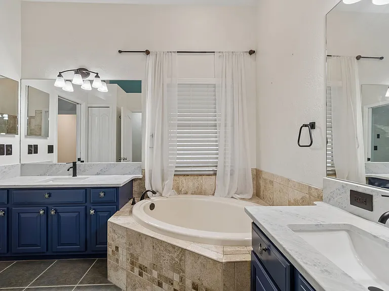 Timeless natural Quartz Dual Vanities in Primary Bathroom