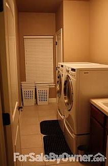 Upstairs Living Room
						:
						Fireplace, Crown molding, 2 in faux wood blinds throughout house