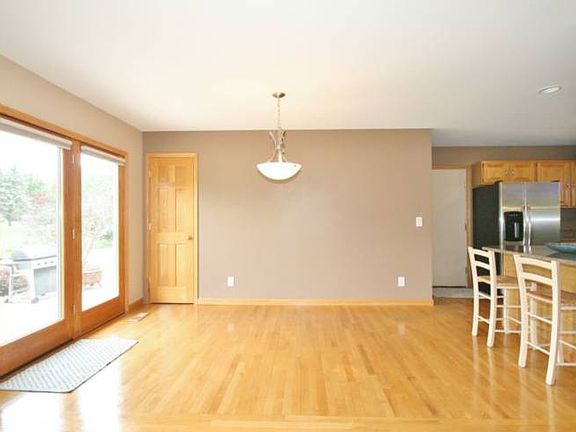 Large Pella doors flood the room with light and have a great view of the back yard. The glass doors lead out to the concrete patio for enjoyment during the warmer months.