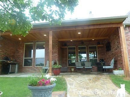 Back porch : Custom covered back porch w entry into brkfst nook Windows look into living room