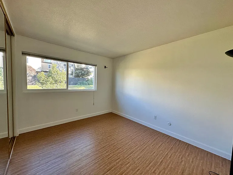 2nd bedroom has an extra wide closet with mirror sliding doors