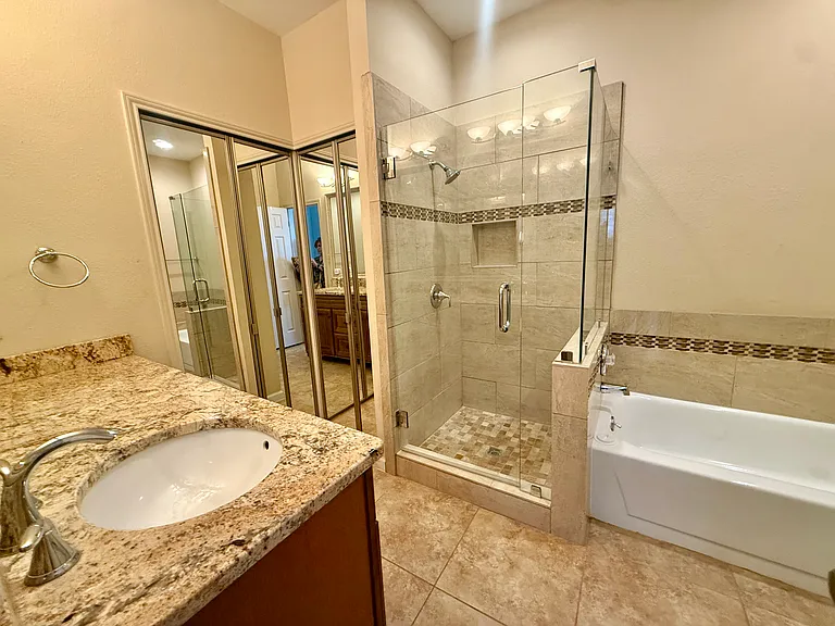 Master bathroom, mirrors are also closets.