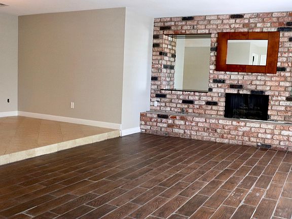 Living area with fireplace (right), dining area (left)