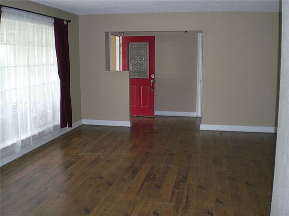 Formal Living and Dining from Kitchen looking toward front entrance