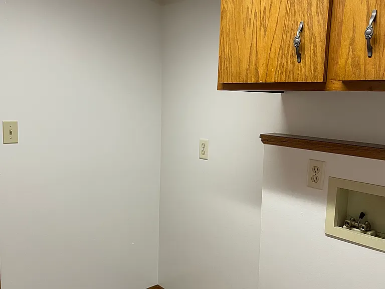Main floor laundry with space for additional refrigerator or upright freezer
