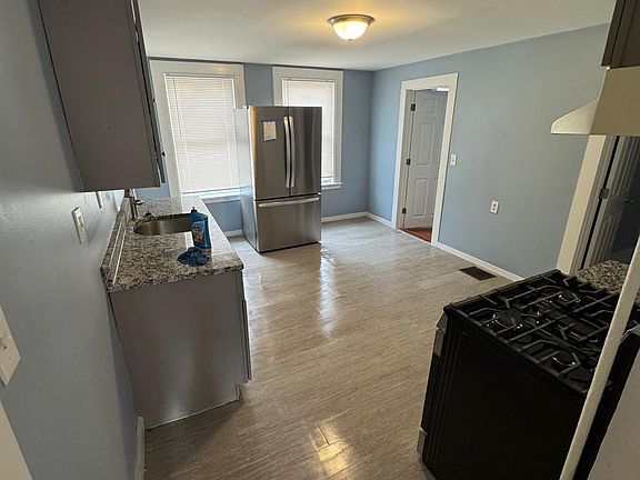 Spacious kitchen with brand new refrigerator and stove