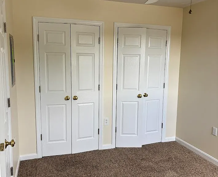 Bedroom 2 with 2 closets and ceiling fan