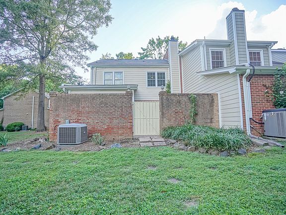 Rear gate leading into courtyard of townhouse