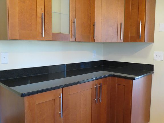 Cabinets are wood and have special features