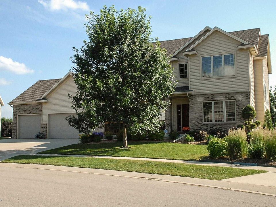 Vinyl siding with brick accents and covered front porch